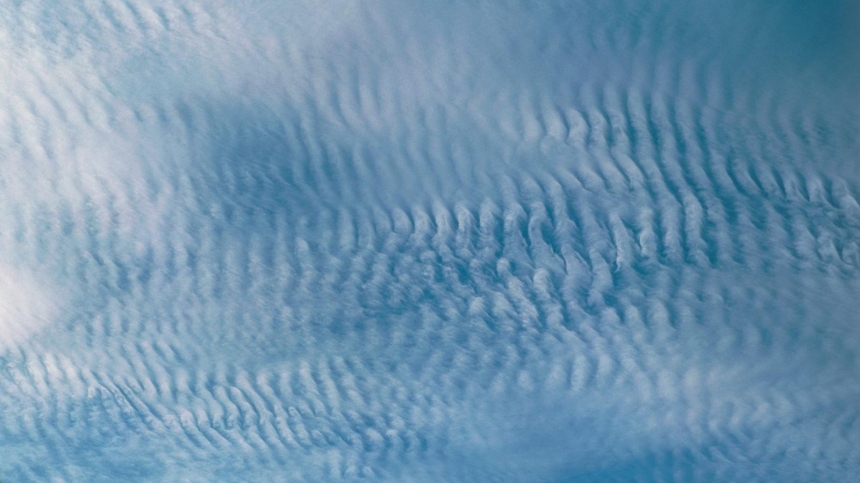 Cirrocumulus clouds forming a mackerel sky / Pekka Parviainen,SPL1,BBC