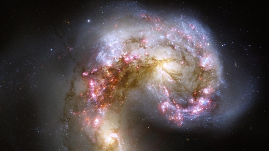 These two spiral galaxies, known as the Antennae galaxies, were once separate but are slowly being pulled together by gravity / NASA,ESA,Hubble Heritage,STScI,AURA